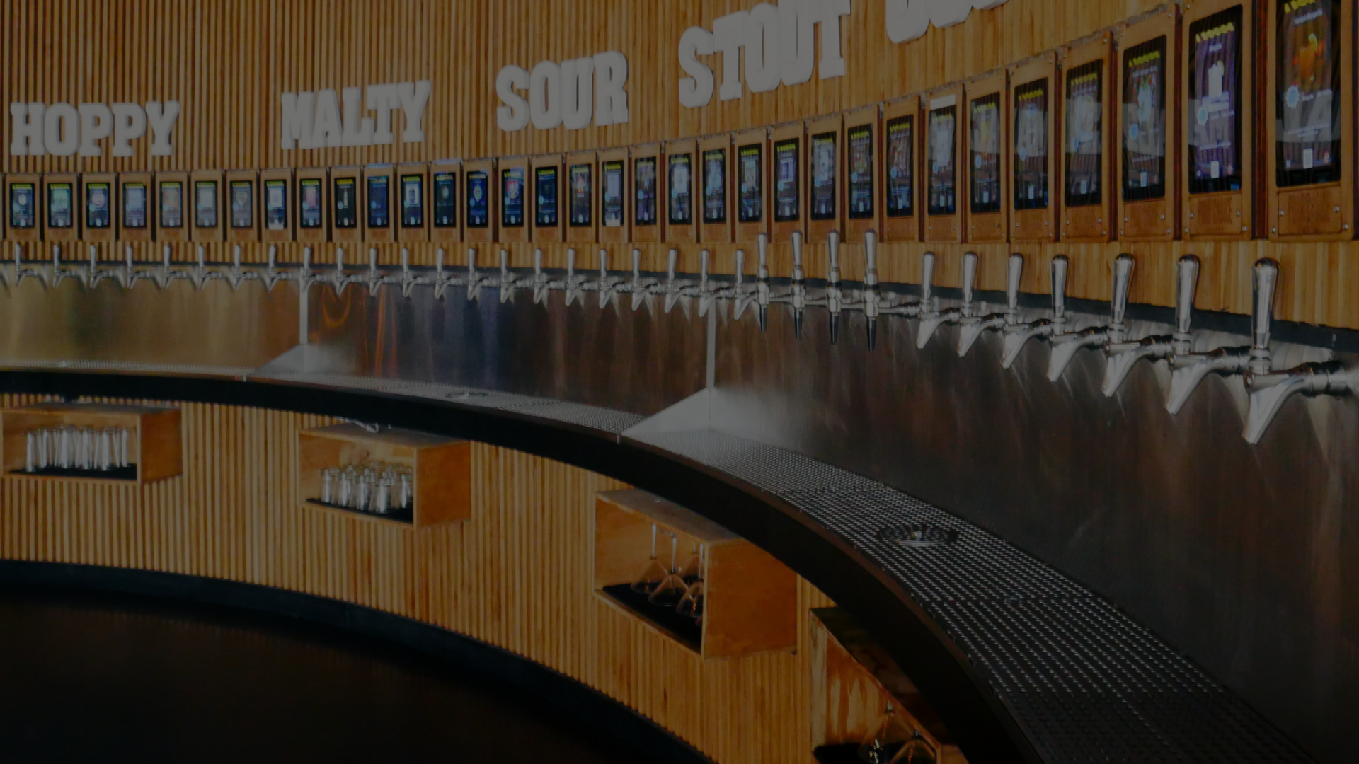The self-pour tap wall at Pour Choice Taphouse in Orlando