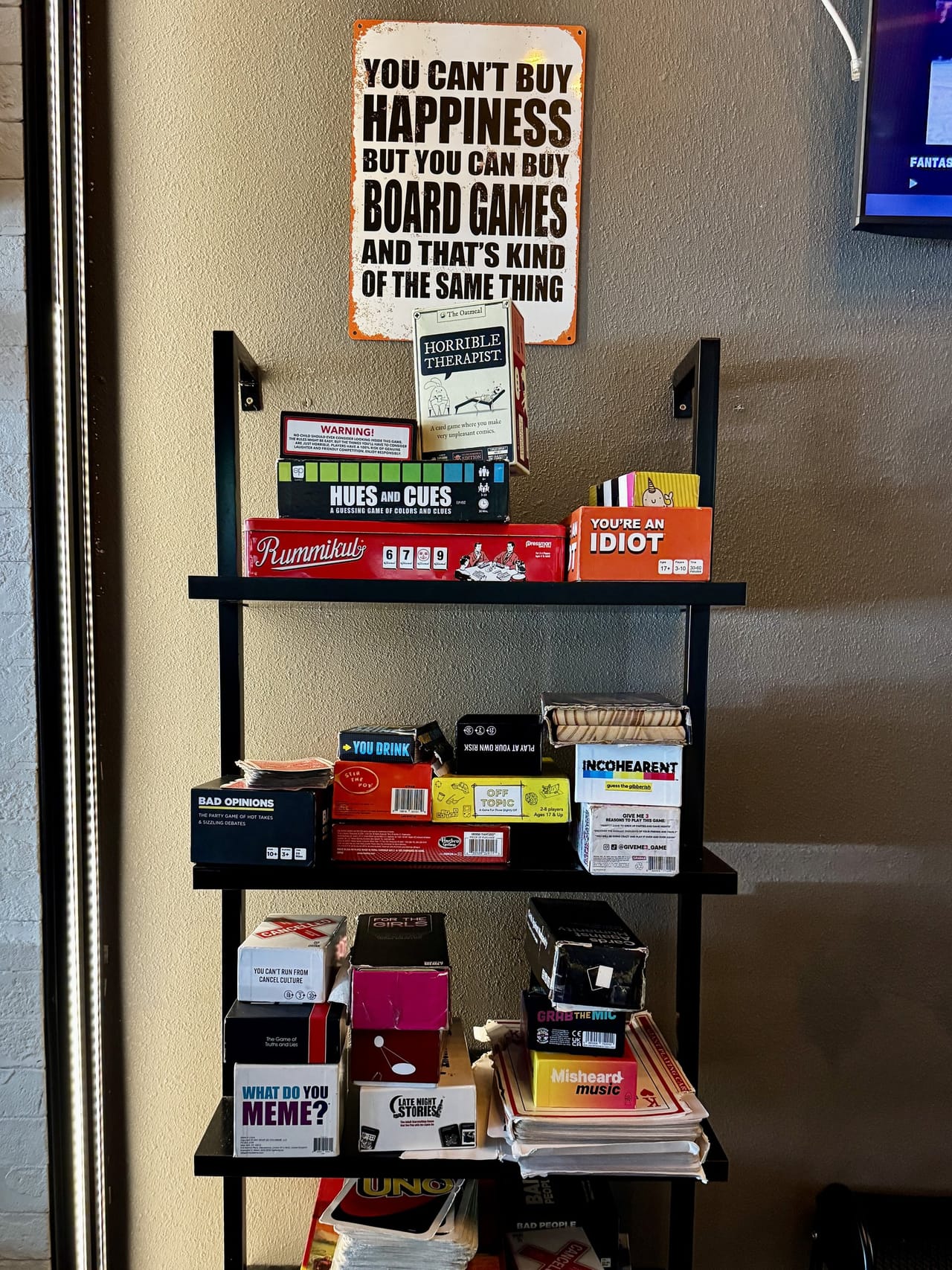 Board game shelf inside Pour Choice Taphouse in Mills 50 Orlando