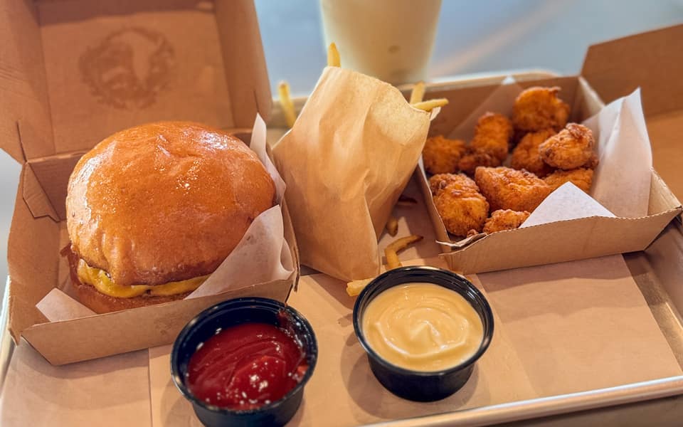 Jay Lucy's burger, tallow fries, and shake on a tray